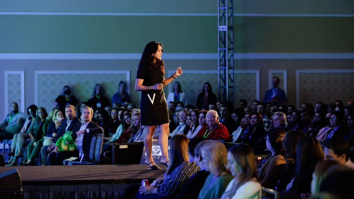 Valerie Woo speaking on stage